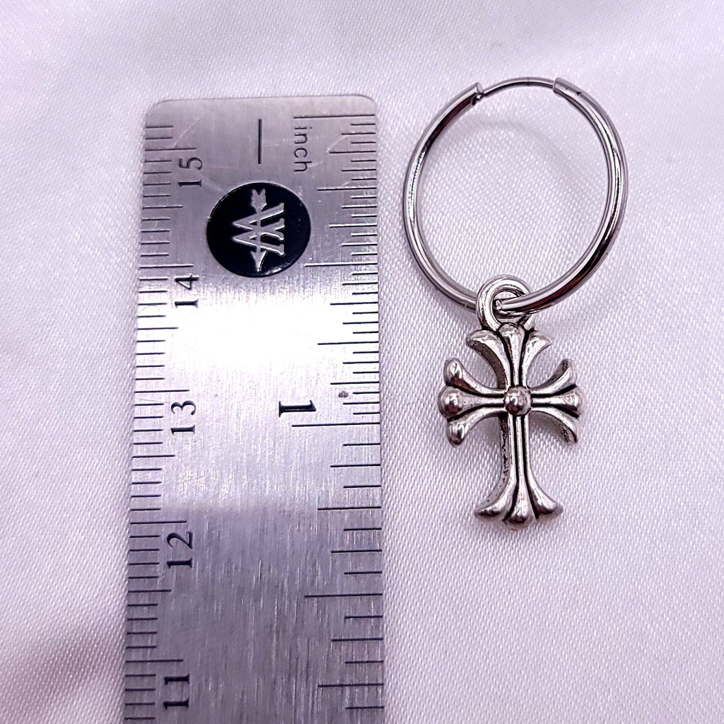 Showing measurement of single silver hoop earrings with cross on a white fabric background. Measuring at around 1.5 inches.